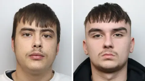 Northamptonshire Police Police custody images of Keiton Underwood and Ace Hill. They are both looking straight at the camera. Underwood has short dark hair and a thin moustache, and he is wearing a white jumper. Hill has short dark hair and a goatee beard. He is wearing a black top.