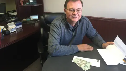 John Zelnio John Zelnio poses with the anonymous letter and 40 dollars