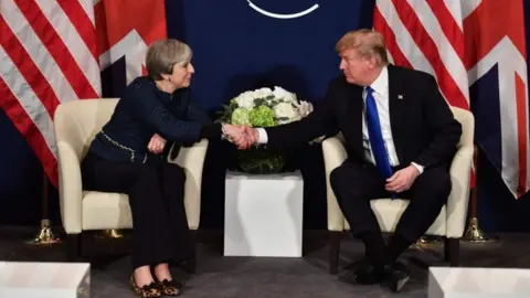 AFP Theresa May and Donald Trump in Davos