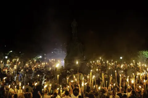 Getty Images White nationalists gather at the base of the Thomas Jefferson statue on the UVA campus