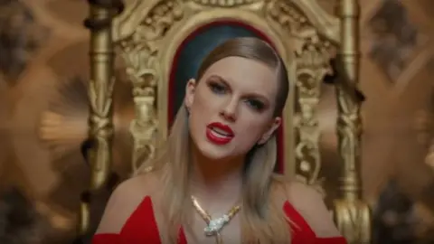 Taylor Swift/Vevo Taylor Swift on a throne