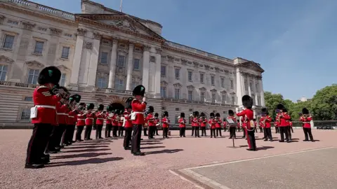 Band of the Irish Guards plays Remember Monday's Eurovision act during the Changing of the Guard at Buckingham Palace.