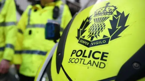 Police Scotland emblem and officers