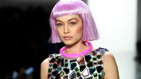 Getty Images Gigi Hadid wearing a purple wig