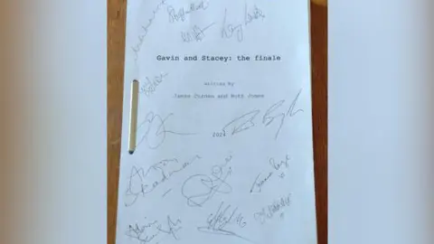 Peoples Fundraising A original Gavin and Stacey script with all of the main casts signatures on it. 
The cover says Gavin and Stacey: the finale. Written by James Corden and Ruth Jones.