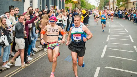 Supplied Joe Spraggins dressed as a swimmer runs the London Marathon