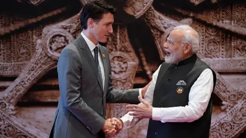 Getty Images India's Prime Minister Narendra Modi (R) shakes hand with Canada's Prime Minister Justin Trudeau ahead of the G20 Leaders' Summit in New Delhi on September 9, 2023