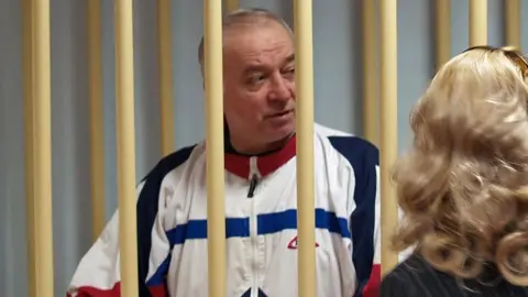 EPA A photo dated 09 August 2006 shows Sergei Skripal talking from a defendants cage to his lawyer during a hearing at the Moscow District Military Court in Moscow, Russia (issued 06 March 2018).