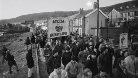 Getty Images Striking mine workers during the miners' strike picket the Maerdy Colliery, one of the last working mines in the south Wales valleys, in Maerdy, Rhondda Cynon Taf, Wales, 6th March 1985.