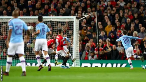 Getty Images Bernardo Silva (right) scores the opener for Manchester City