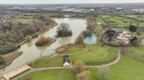 An overhead shot of Wicksteed Park, showing a lake.