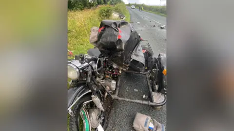 North Yorkshire Ural Police motorbike on roadside with serious damage 