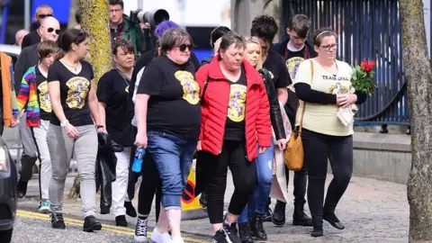 PAcemaker friends of Ms mckee arrive wearing lyra hufflepuff tshirts