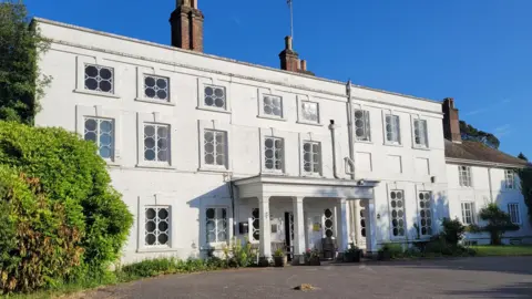 Foxie's Future Exterior of Foxlease - whitewashed Georgian house with three storeys