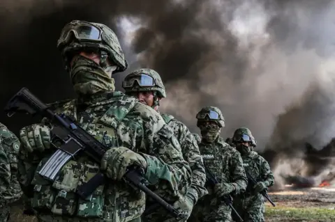 DAVID GUZMAN/ EPA Members of Mexico's Marines participate in the destruction of drugs