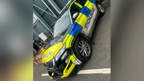 PSNI Picture shows damage to PSNI car