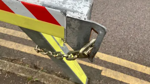 Richard Daniel/BBC A close-up of the lock on a gate