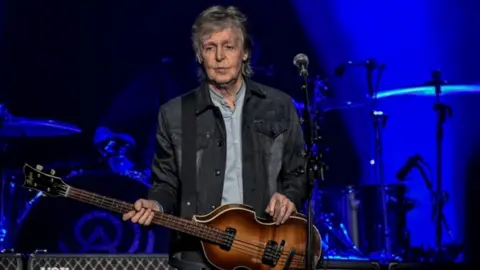 AFP/GETTY Paul McCartney performs on November 28, 2018 at the U Arena stadium in NanterrE