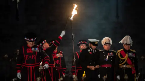 Getty Images The first torch is lit in a ceremony to mark armistice day at the Tower of London