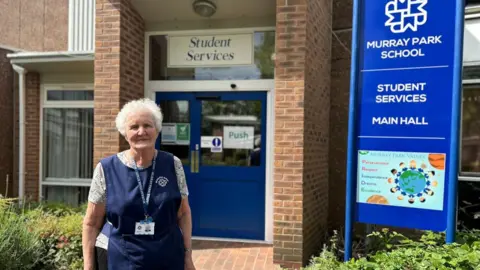 Mary Irwin outside school