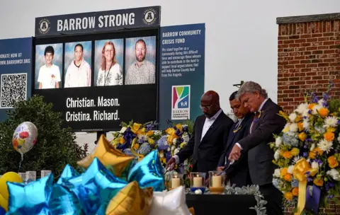 Getty Images Photos of the victims of the Apalachee High School shooting are displayed on a screen during a vigil at Jug Tavern Park in Winder, with politicians lighting candles in the foreground, in Georgia, U.S. September 6, 2024