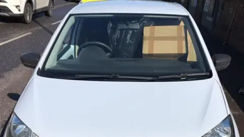 South Yorkshire Police Car overloaded with parcels