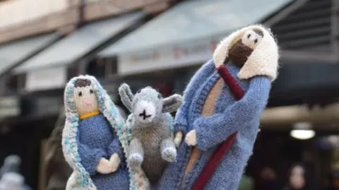 Miniature knitted figures of Mary, Joseph and the donkey