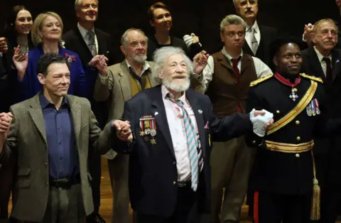 Getty Images Sir Ian McKellen (centre with medals) at the press night performance of Players King in London on 11 April 2024