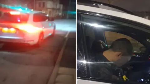 Composite image showing on the left a plain white car with lights on in a street at night, and on the right a shot through the driver's window showing two men in police uniform, with faces obscured, apparently asleep inside.