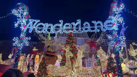 East Kent Hospitals University NHS Trust Christmas lights on a house. There is a sign above which says "Wonderland".