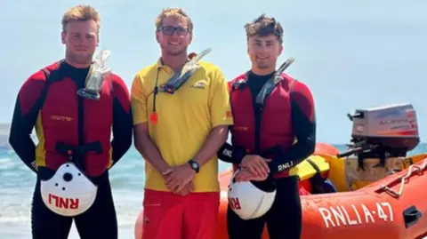 RNLI RNLI lifeguards at Sedgewell Cove in Bigbury