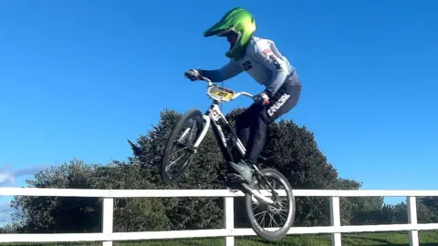 Henry performing a BMX stunt