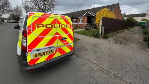 Shaun Whitmore/BBC Police at the scene at Grayson Avenue, Pakefield