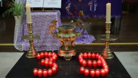 PA Media Candles in the shape of the number 39, at the memorial service for the victims.