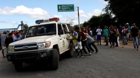 Reuters An ambulance at the scene where several people were injured during clashes in the southern Venezuelan town of Kumarakapay, 22 February 2019