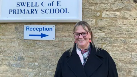 A women standing outside a school