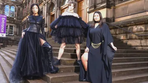 Models (L-R) Grace Dempsey, Joshua Cairns and Shannon Summers arrive at the National Museum of Scotland ahead of the opening of Beyond the Little Black Dress