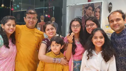 Priyanka Miglani (centre) and family