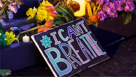 EPA Flowers and candles were brought to George Floyd Square as people celebrate after former Minneapolis Police Officer Derek Chauvin was found guilty on all counts in the death of George Floyd in Minneapolis, Minnesota, USA, 20 April 2021.