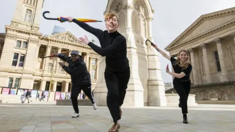 PA Media Dancers Thomas O"Flaherty, Jess Murray and Jess Rowe perform at the Chamberlain Square in Birmingham to launch the Birmingham 2022 Festival.