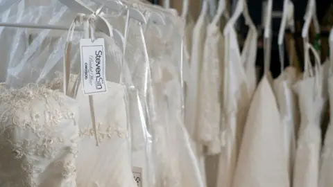 PA Media Designer labels in the donated wedding dresses.