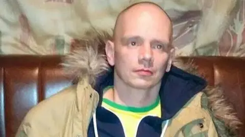 PSNI Piotr Krowka whose body was found in a former parochial house on Glen Road