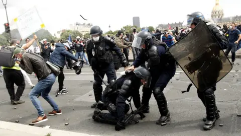 EPA French riot police receive projectiles during an anti-government protest in Paris, France, 16 June 2020