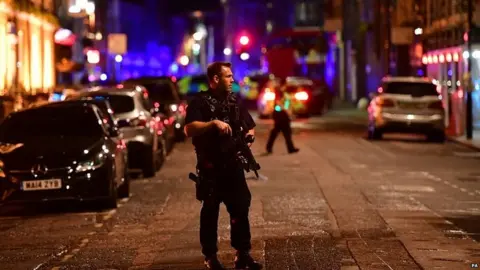 PA Armed police officer in central London