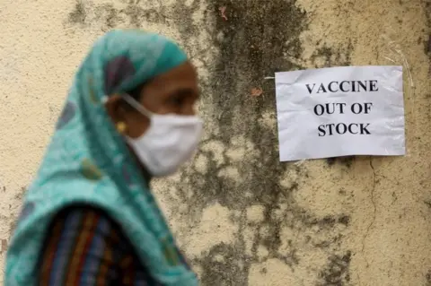 Reuters A notice about the shortage of coronavirus disease (COVID-19) vaccine supplies is seen at a vaccination centre, in Mumbai, India, April 8, 2021.