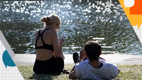 Getty Images Sunbathing in park