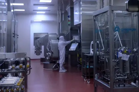 Reuters A research scientist works inside a laboratory of India"s Serum Institute, the world"s largest maker of vaccines, which is working on vaccines against the coronavirus disease