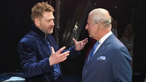 Jeff Spicer via Getty Images King Charles III speaks with Sir Kenneth Branagh who played the role of Prospero after the Royal Shakespeare Company's performance of The Tempest