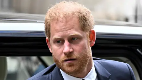 Britain's Prince Harry, Duke of Sussex walks outside the Rolls Building of the High Court in London last June