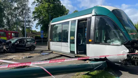 Damaged car and tram at Queen's Walk in Nottingham